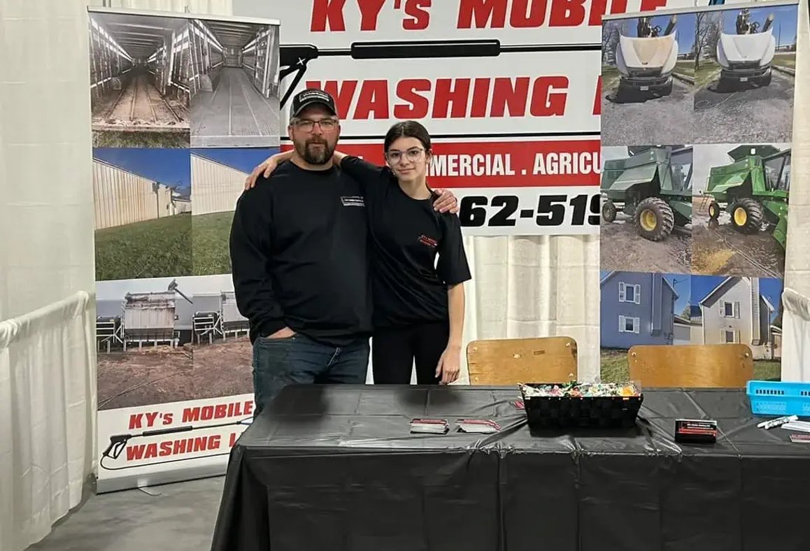 kyle at the trade show, with his daughter